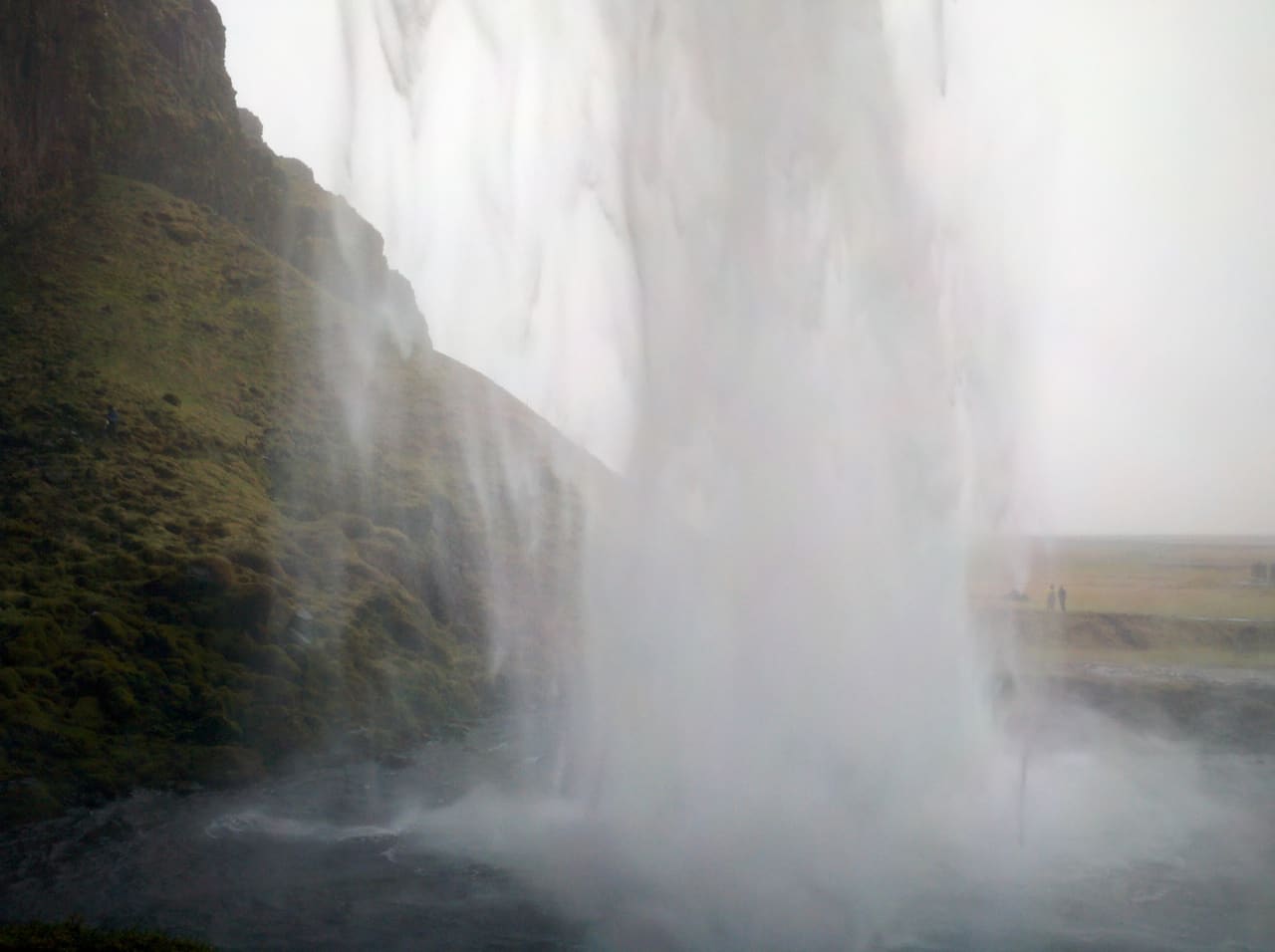 View from behind the Icelandic waterfall Skogar